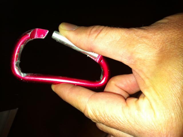 Carabiner bent by wind force.